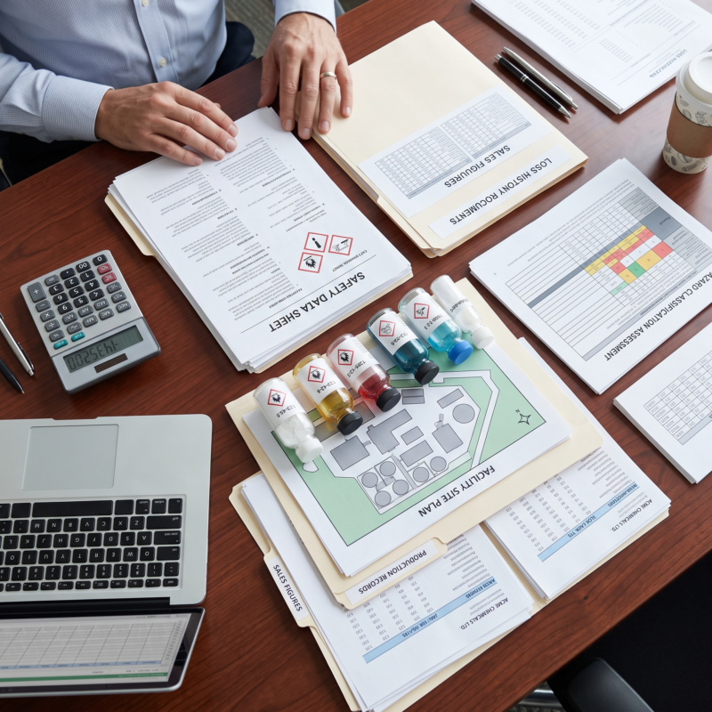 Chemical Manufacturer Insurance submission package featuring loss runs, safety data sheets, process information, emergency plans, and required contracts.